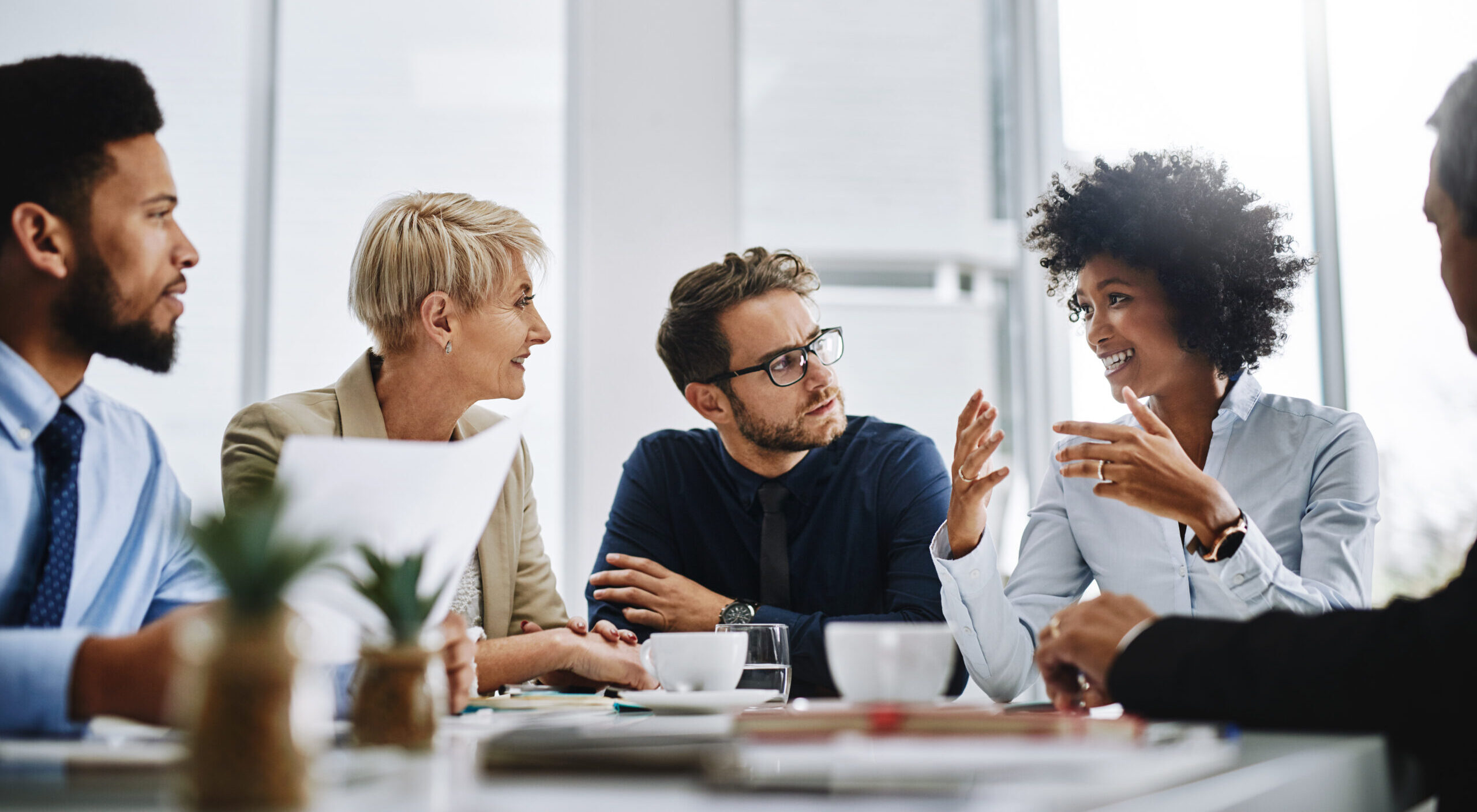 Shot of a group of businesspeople sitting together in a meeting
